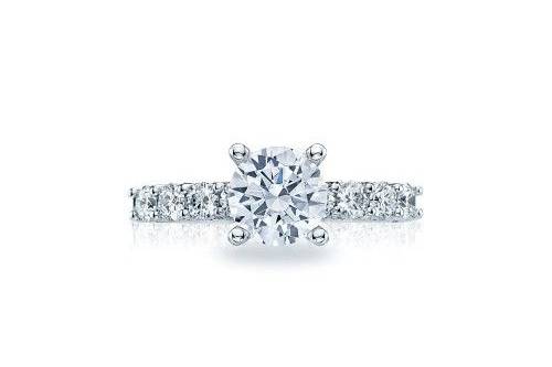 TACORI2598rd7There is vintage appeal in this stunning diamond engagement ring, pictured with four large round diamonds on each side of the band and round pavé set diamonds accenting the crescent silhouette details.