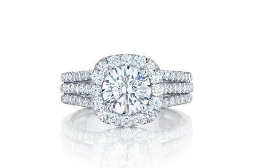 TACORIHT2551CU75For those Tacori girls who love a cushion look, this truly unique Tacori engagement ring offers the cushion shape every girl loves with a round brilliant center diamond. With three diamond filled bands leading their way up to the crown, this Tacori engagement ring will take her breath away.