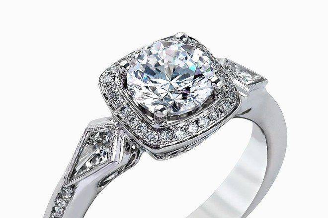 SIMON GMR2423The romantic setting of this vintage-inspired white gold ring highlights an eye-catching halo and .20 ctw of glistening round cut white diamonds and .23 ctw of kite shaped diamonds.