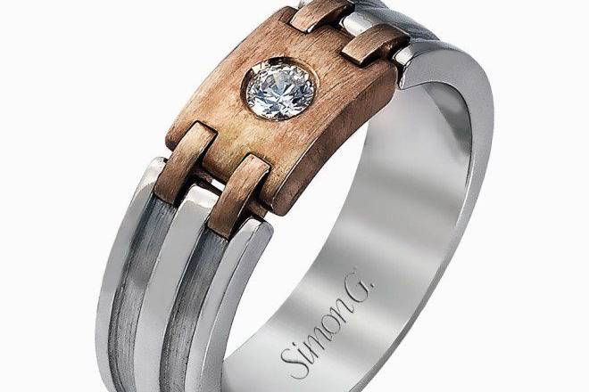 SIMON GLP2079Presenting a thoroughly modern design, this two-tone men’s white gold band is accented by rose gold accents and .13 ctw round white diamonds.