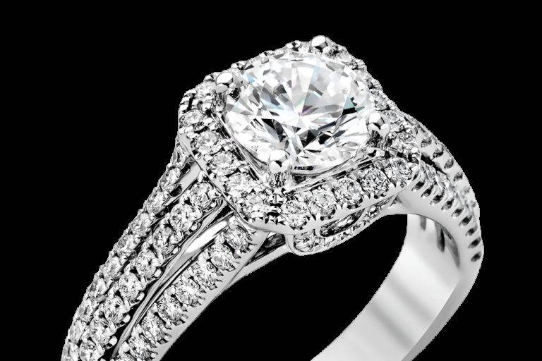SIMON GMR1904Presenting a dramatic contemporary setting, this white gold engagement ring is accentuated by .70 ctw of impressive round cut white diamonds.