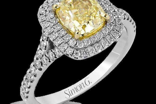 SIMON GMR2414This lovely engagement ring features a cushion shaped double halo design set with .54 ctw of white diamonds.