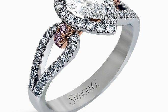 SIMON GNR467Featuring a lovely pear-shaped halo, this contemporary white and rose gold engagement setting is complemented by a split shank design containing .45 ctw round cut white diamonds and .08 ctw pink diamonds.