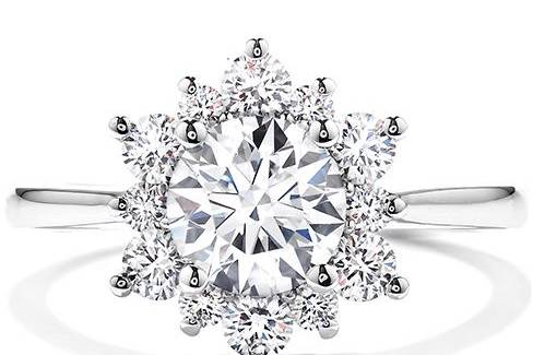 HEARTS ON FIREDELIGHT LADY DI DIAMOND ENGAGEMENT RINGThe perfect diamond engagement ring for the woman who wants simple but dazzling. A wreath of Hearts On Fire diamonds encircle the perfectly cut center diamond, creating a truly elegant and unique look.