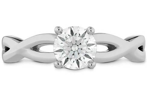 HEARTS ON FIREDESTINY TWIST SOLITAIRE ENGAGEMENT RINGThis elegant Diamond Solitaire Engagement Ring has a stylish, twisted metal band cradling a perfectly cut Hearts On Fire Diamond to create a classic symbol of eternal love.