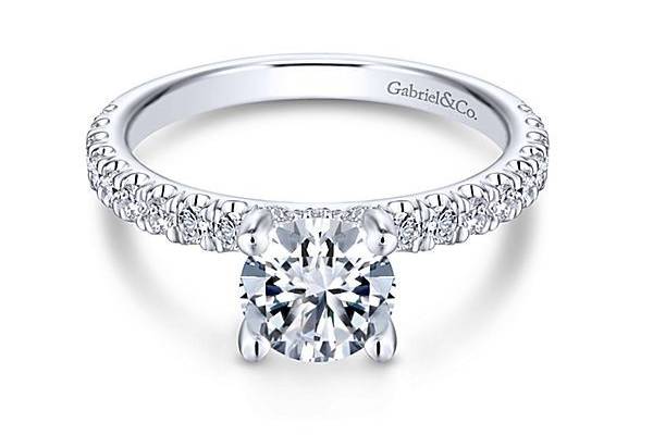 GABRIEL & COAMIRAThe perfect choice for your perfect girl, this sparkling round cut engagement ring with a scalloped pave diamond band is a modern marvel.