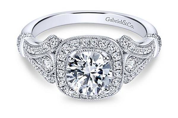 GABRIEL & CODELILAHIn this engagement ring, a glamorous diamond halo center stone is accented by ornate vintage detailing, reminiscent of the glitz and glam of the jazz era.