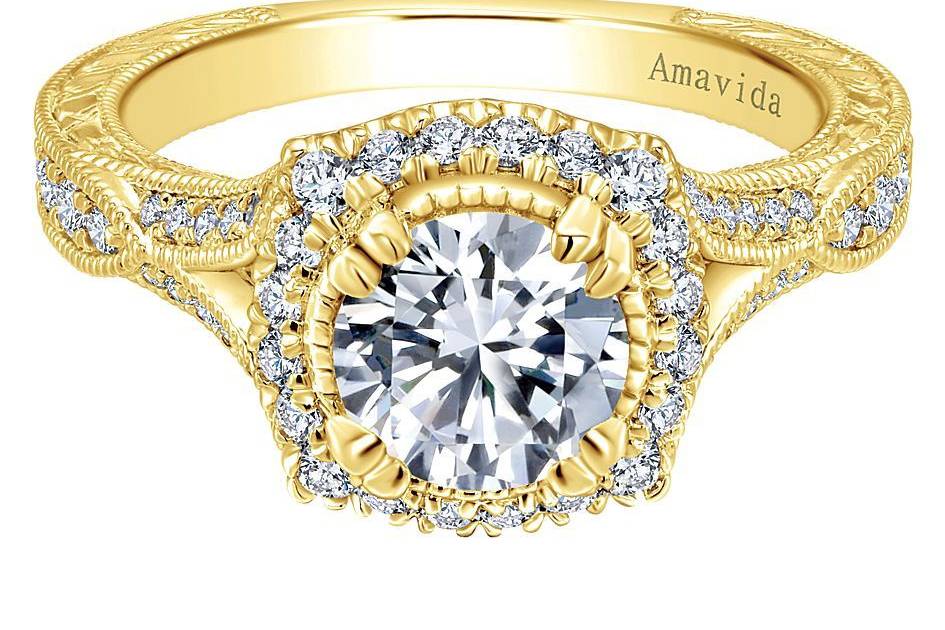 GABRIEL & CODARYAA graceful diamond halo center stone is accentuated by a striking pave diamond band in this 18K yellow gold Amavida engagement ring