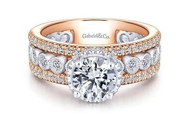 GABRIEL & COETHELBezel set round diamonds punctuate a pave diamond rose gold band. This straight, modern engagement ring is the perfect canvas for a round cut center stone.