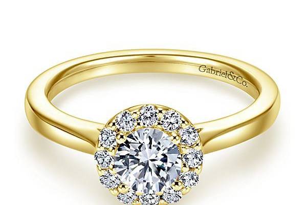GABRIEL & COLANAA beautiful round halo of shimmering diamonds frames your choice of round center stone in this fresh and modern yellow gold engagement ring.