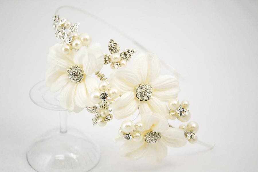 Romantic or classic, elegant or whimsical, wedding headbands are a wonderful option for accessorizing your wedding day look. This boho chic headband features blooming flowers embellished by rhinestones and pearls.