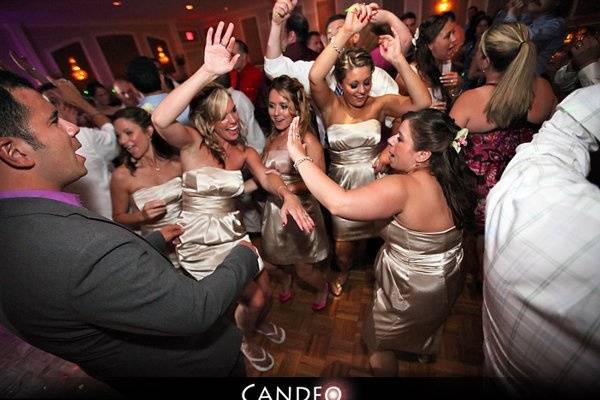 Bridesmaids dancing with the guests