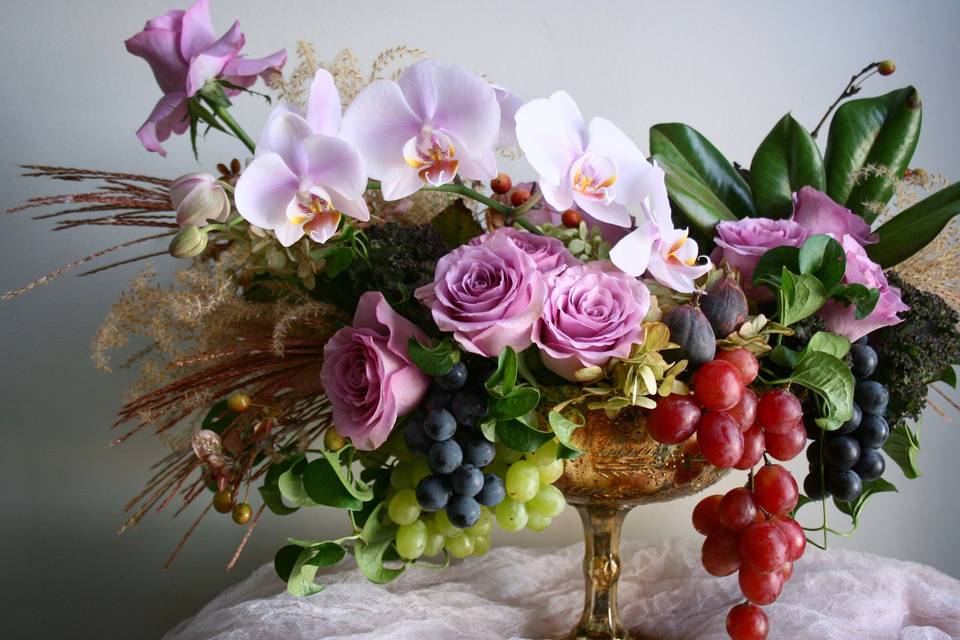 Late summer centerpieces with orchids, grapes and figs