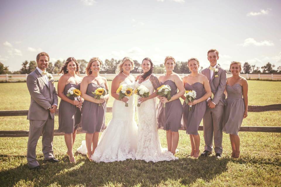 The couple with the bridesmaids and groomsmen