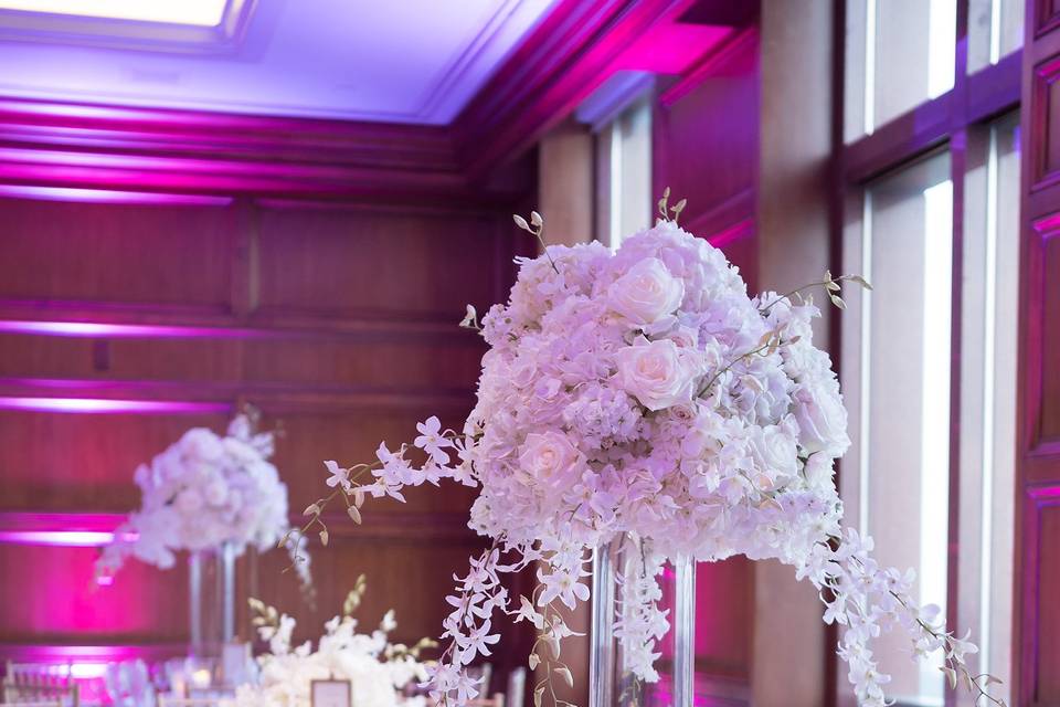 Table setting and raised floral centerpiece