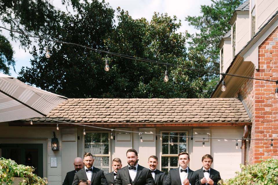 Groomsmen Exiting Manor House