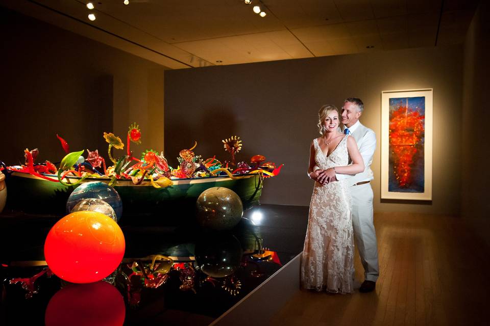 This couple had a photography session in our Dale Chihuly galleries before their reception on the Roof Terrace.Photo Credit: Travis + Haley G