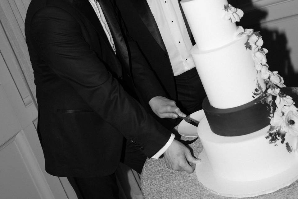 Grooms cutting cake