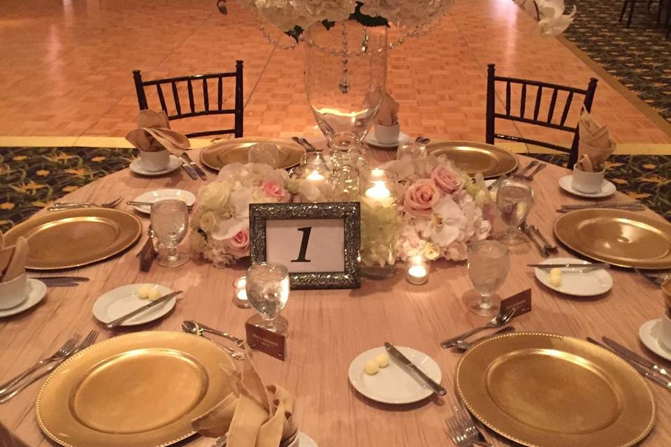 Table setup with floral and candle centerpiece