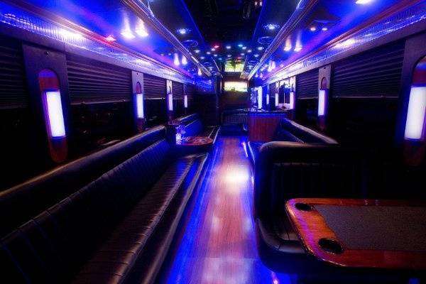 30 passenger Limo Liner interior.  Stand up bar is on the right and restroom is in the back on the left.