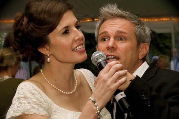 An impromptu duet with Lauren The Bride and Adam James during Summer wedding in South Barrington Illinois.  The reception was held in a tent with full dance floor.