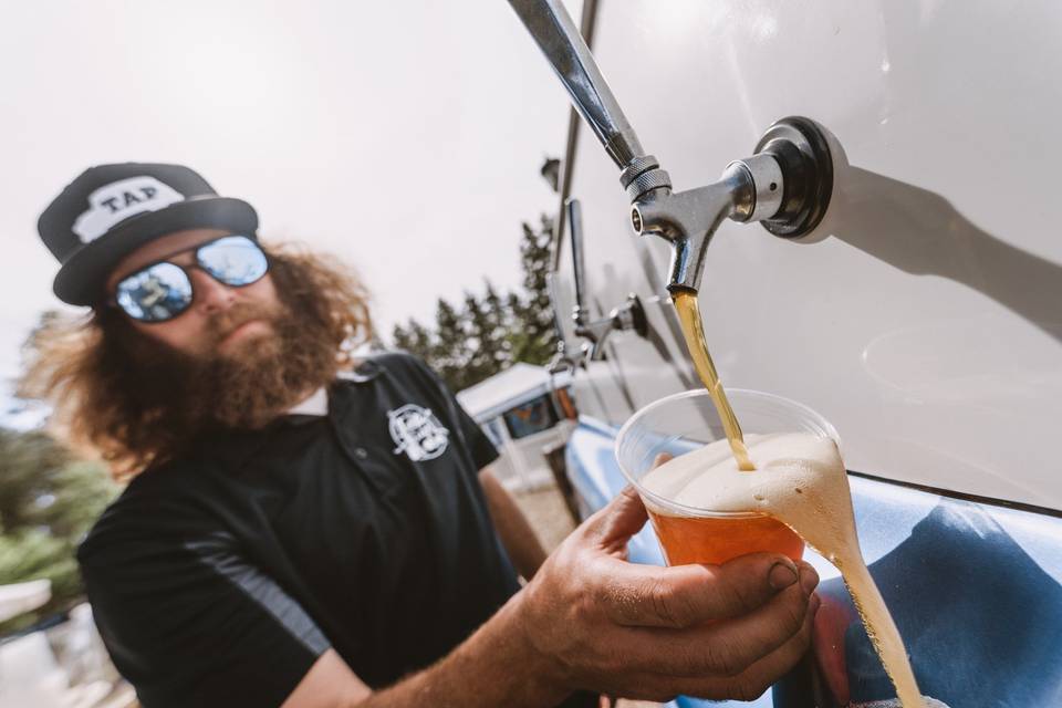 Vintage beer truck pouring.