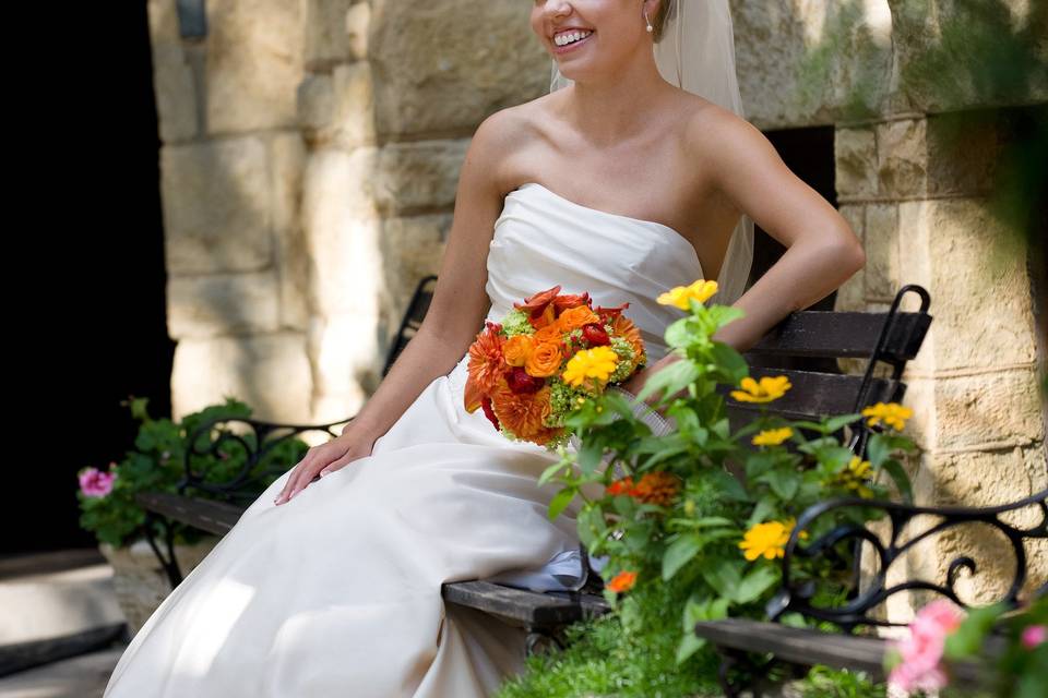 Bride sitting by the flowers