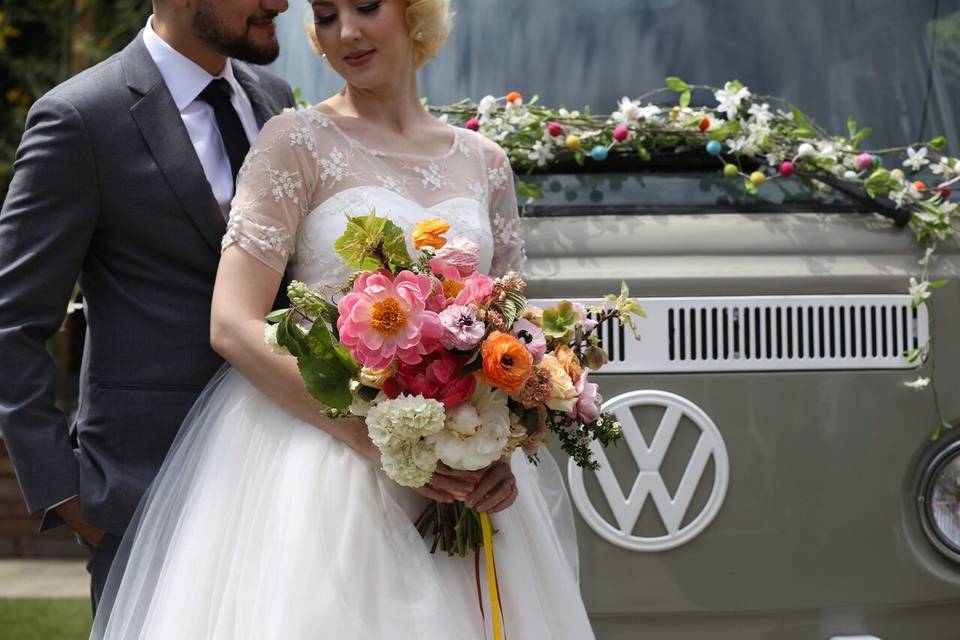 Newlyweds by the mini bus