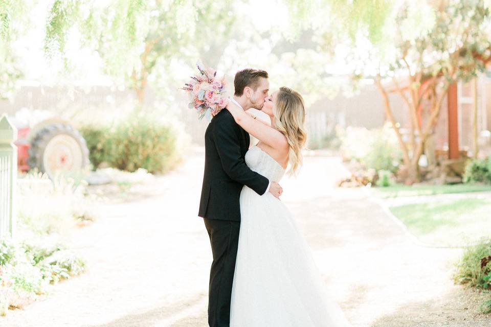 Groom kissing his bride