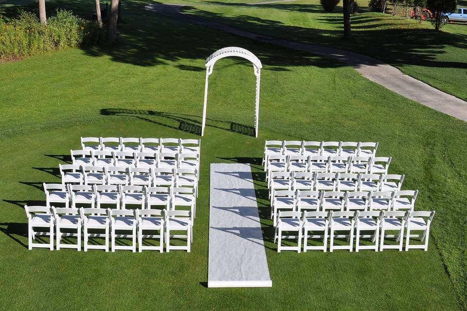 Wooden arch w/ resin chairs