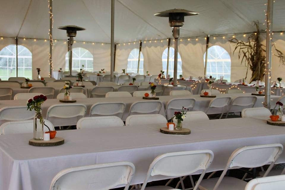 Banquet tables w/ white chairs