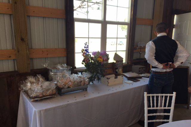 Bride and groom's gift table with cookies and sign in book