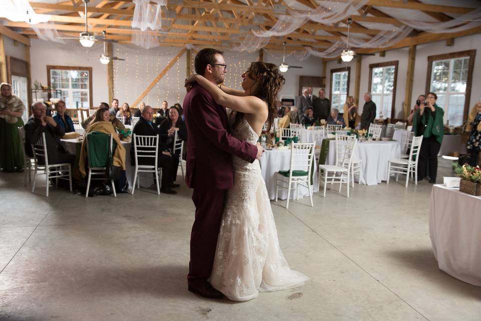 Bride and groom dancing in bar