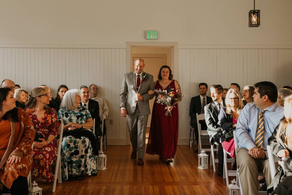 Groom and bridesmaid walking