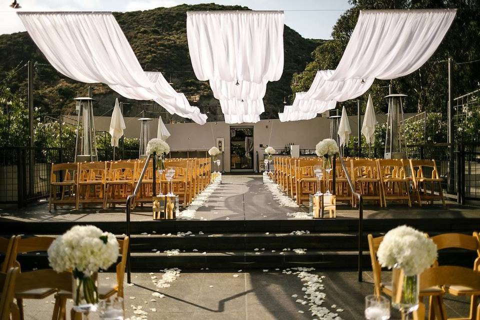 Ceremony with white fabric draping