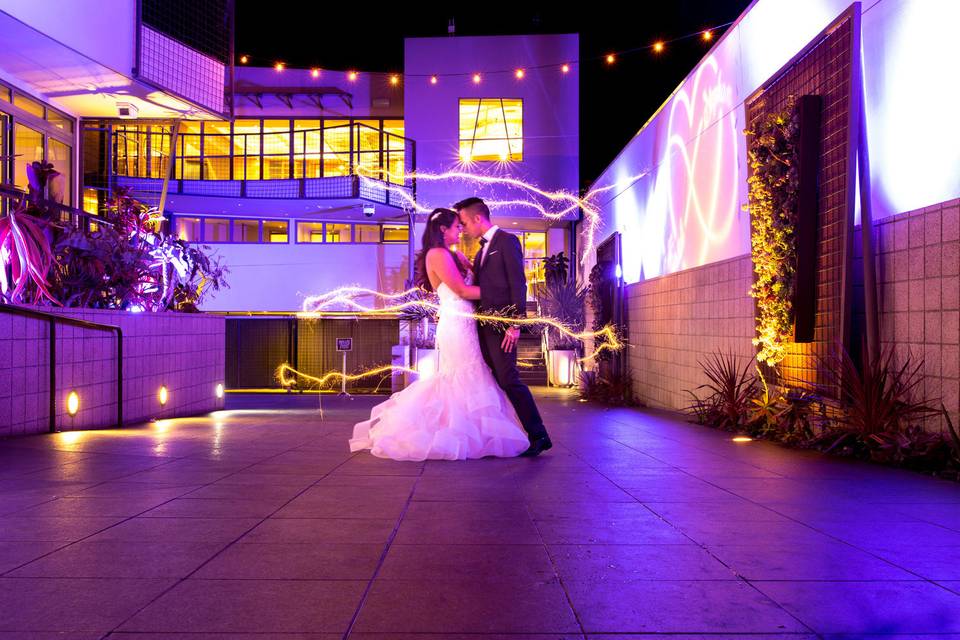 Drive night shot with couple and purple lighting