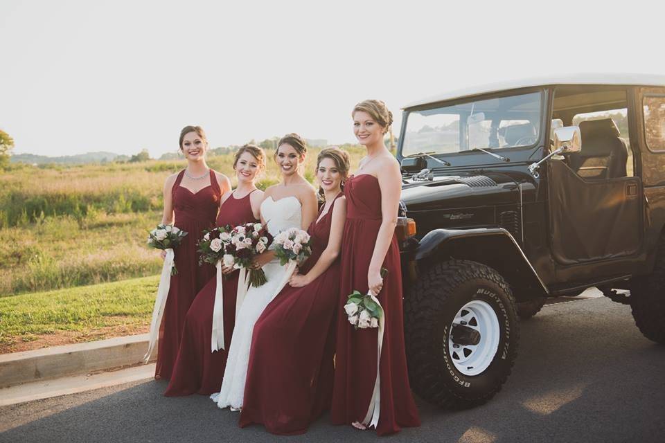 Bridesmaids chose different style of chiffon dresses in the same shade of burgundy.  Bouquets had shades of burgundy and navy for contrast. | Sullivan Photography Floral: Melissa Timm Designs