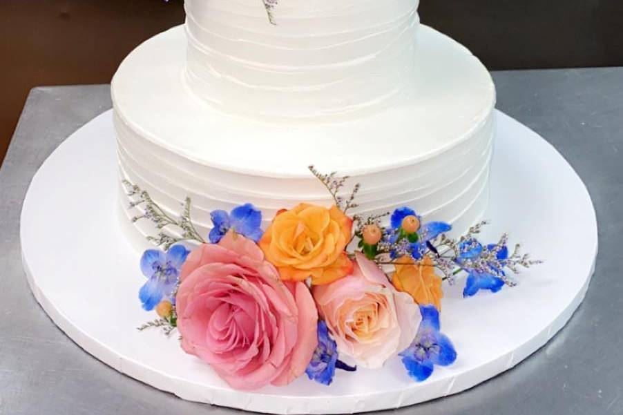 Multi-colored flower tier cake