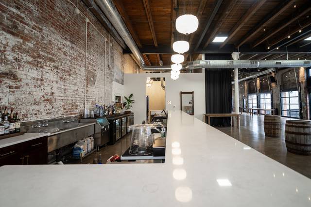 Marble bar with whiskey barrels