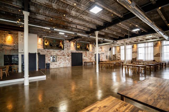 Sunlit hall with exposed brick