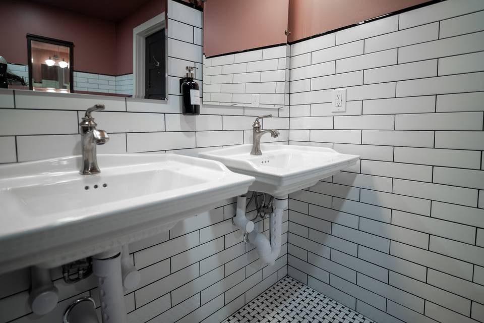 Classic restroom with pedestal sinks