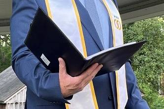 Cogan leading ceremony
