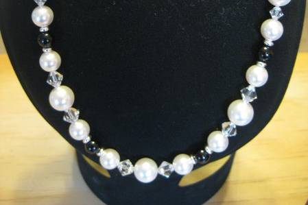 Black and White Chech Pearls with clear Swarovski accents and silver spacers with a lobster closure. Earrings on SS wires. Gold-tone available.