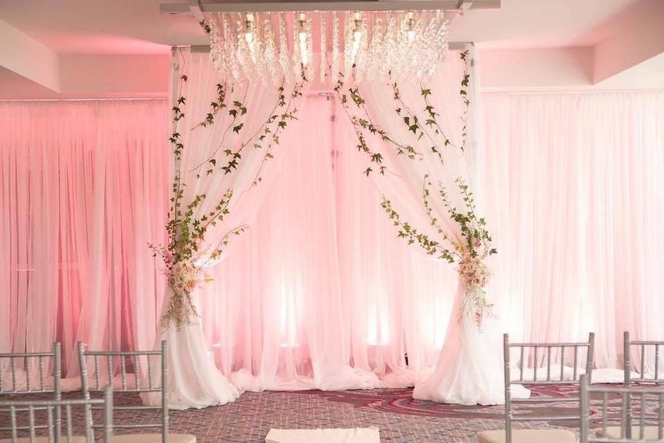 Wedding arch and drapes | PC: JJ Weddings