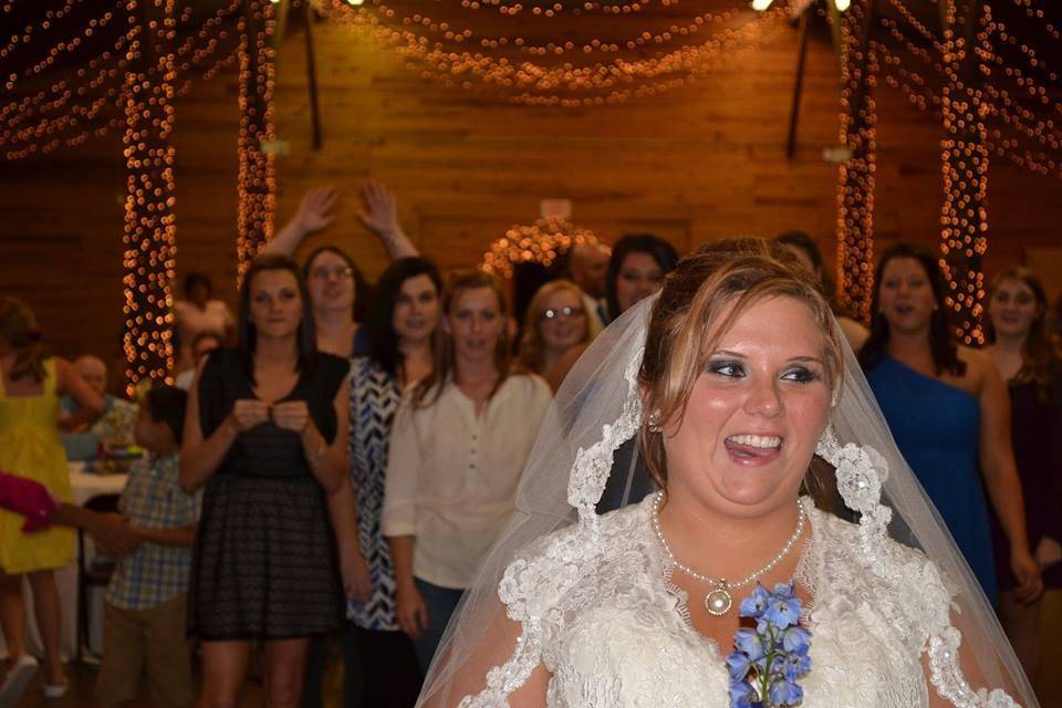 The bride tossing her bouquet