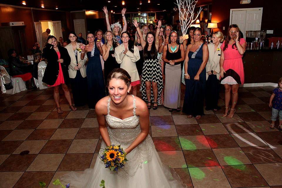 The bride tossing her bouquet