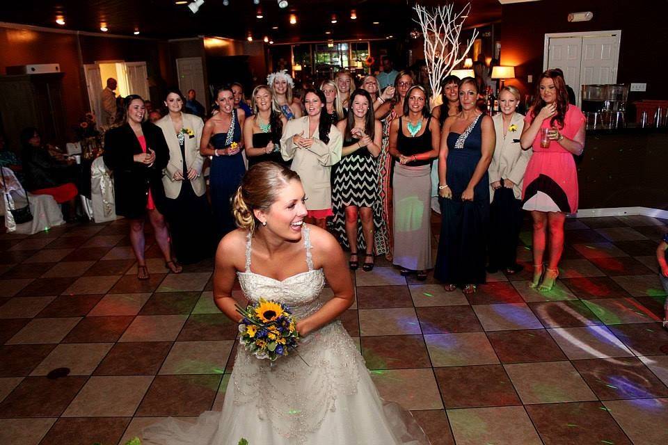 The bride tossing her bouquet