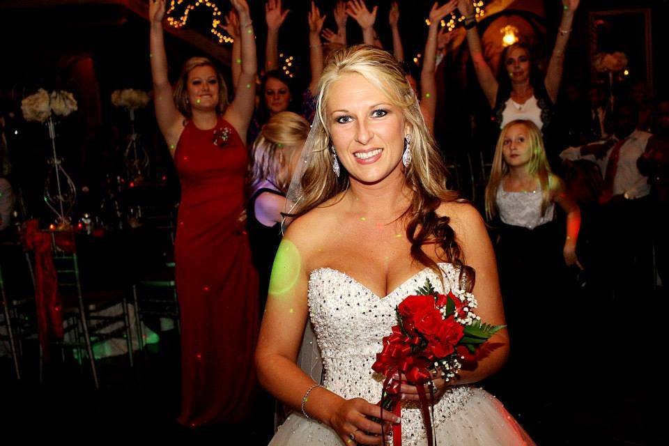 The bride tossing her bouquet