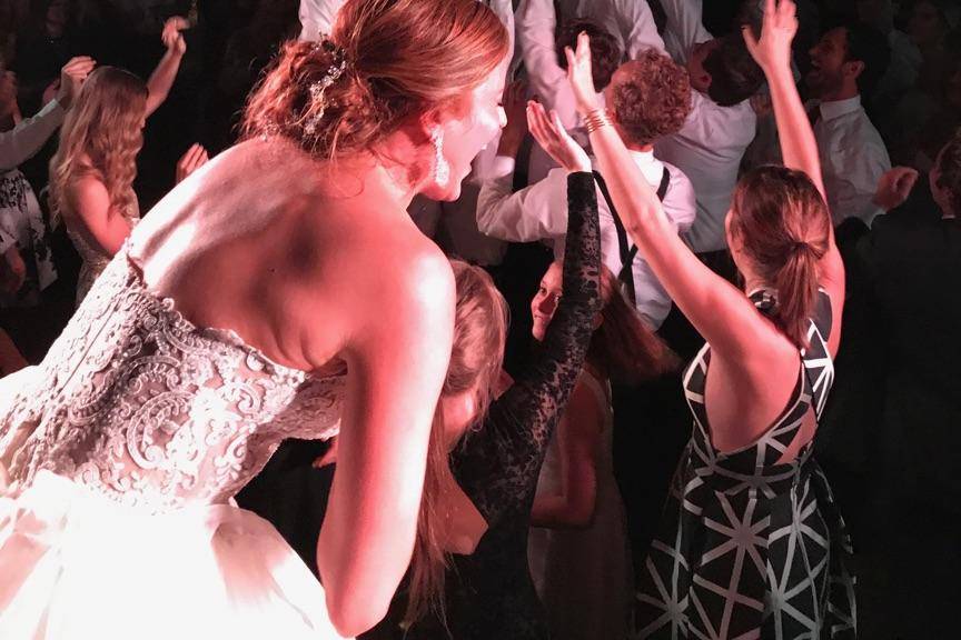 Groom crowd surfs from stage.