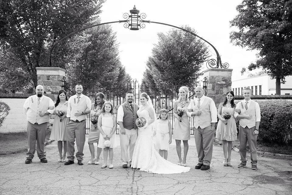 The couple with the bridesmaids and groomsmen